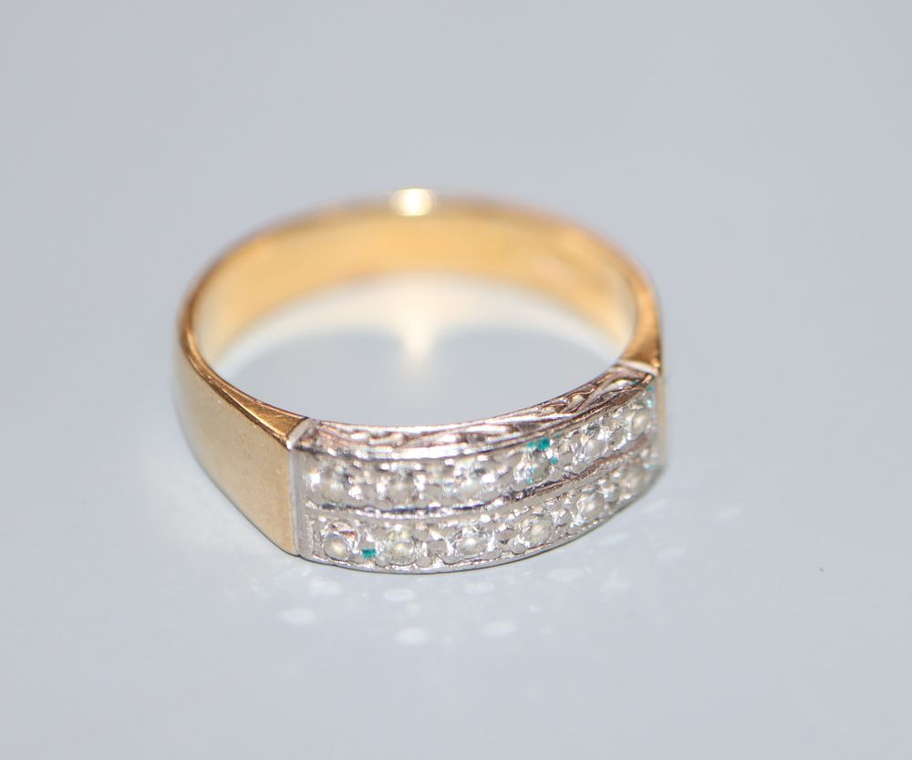 A modern 18ct gold and two row diamond half hoop ring, size J/K, gross 4.1 grams.